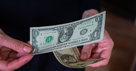 woman with paying a bill with money
